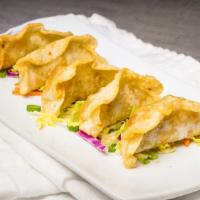 Potstickers · served with a sweet chili sauce