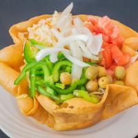 Taco Salad · Taco shell with seasoned ground beef, cooked with onion, tomato sauce. Topped with crisp let...