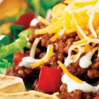 Taco Salad · fried tortilla shell, lettuce, pickled jalapeño, ranch sauce, pico de gallo, monterey jack c...
