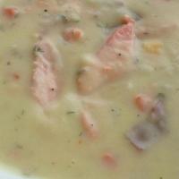 Salmon Chowder* · Flakes of wild salmon in a creamy redskin potato soup with mix vegetables, butter & cream. GF