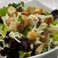 Caesar Salad* · A mixture of Romain and artisan lettuce top with Parmesan cheese and house-made croutons