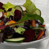 Garden Salad* · A blend of Romain and artesian lettuce, carrots, cucumbers, fresh, beets, radish, red cabbag...