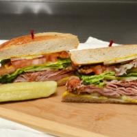 Cuban Sandwich · Grilled ham, bacon, pickles, Swiss cheese and mustard lettuce, tomatoes and onion on grilled...