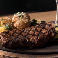 Ny Strip Steak · 12 oz NY strip steak, sautéed mushrooms and onions glaze, fresh vegetable medley, roasted po...