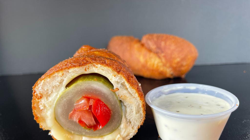 Bloody Mary Dill Dough · Cored Dill Pickle stuffed with Celey salt flavored Tomato, and Sweet Peppers rolled in a Spicy Dough with Melted Mozzarella.