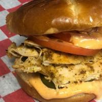 Pulled Chicken Sandwich · Roasted and Shredded Chicken Breast served on a Brioche Bun with a Spicy Honey Mayonnaise, P...