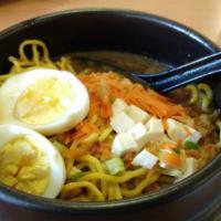 Chicken Katsu Ramen · Cooked. Crispy chicken, noodles, tofu, hard-boiled egg, green onion, nori flakes, & carrot i...