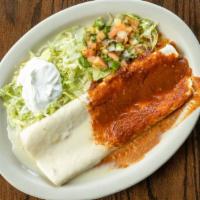 Sonora Burrito · Filled with shredded beef, beans and rice. Smothered in spicy ranchera sauce, sour cream and...
