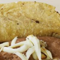Frijol Con Queso · Cheese and beans.