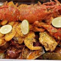 Super Seafood Combo · Shrimp, lobster, snow crab legs, mussels, crawfish with potatoes and corn (8 lbs).