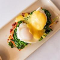 Jalapeno Cornbread Benedict · Jalapeno corn bread with avocado, spinach, bacon and two poached eggs topped with hollandais...