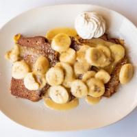 Banana Foster French Toast · Three slices of banana bread dipped in our special batter, topped with banana foster sauce a...