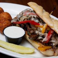 Loaded Philly Cheesesteak · Our Traditional Philly Cheesesteak adding caramelized onions, wild mushrooms, melted provolo...