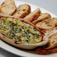 Artichoke Dip · Spinach, artichoke hearts, garlic and three cheese blend with cream cheese in a white sauce....