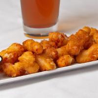 Cheese Curds · Cajun and garlic white cheddar Ellsworth curds. Served with our house buttermilk ranch