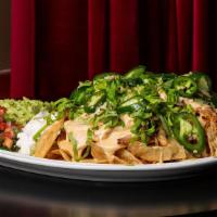 Gouda Chicken Nachos  · House made tortilla chips, tomatoes, jalapeños, onion and diced chicken smothered in a Gouda...
