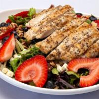 Blueberry Salad · Pecans top off a seasoned, grilled chicken breast, spring greens, blueberries, strawberries,...