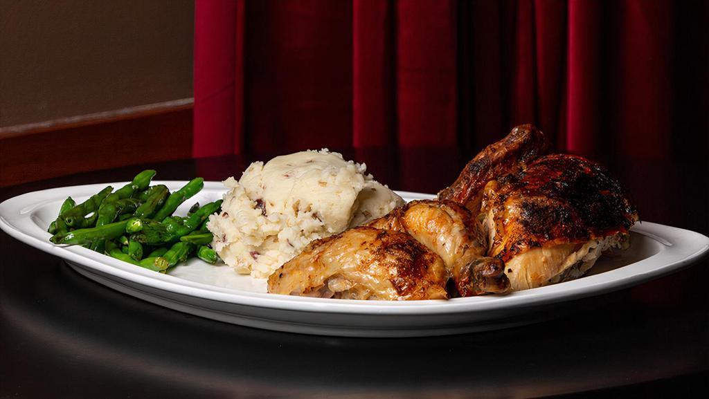 Rotisserie Chicken · Half of a 3.5 lb. rotisserie chicken, seasoned and roasted, served with your choice of side.