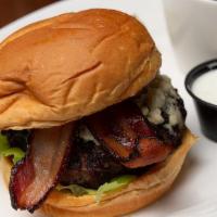 Bacon Bleu Burger · Wisconsin cherrywood smoked bacon with gorgonzola  crumbles. Served with fries.