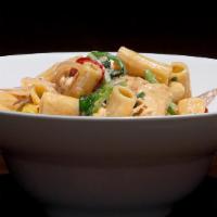 Chicken Rigatoni · Pulled, marinated chicken and rigatoni noodles in a white wine cheese sauce tossed with saut...