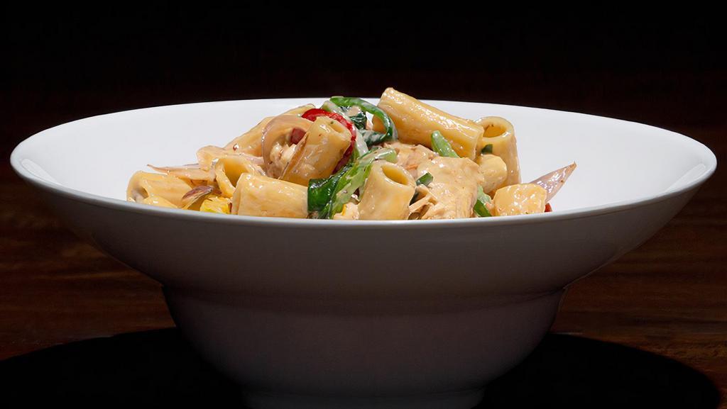 Chicken Rigatoni · Pulled, marinated chicken and rigatoni noodles in a white wine cheese sauce tossed with sautéed shallots, bell pepper mix and spinach.