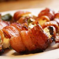 Bacon Wrapped Jalapeno · Five Stuffed jalapeno poppers stuffed with our cheese mixture and wrapped with smoked bacon!