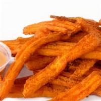 Sweet Potato Fries · Crispy and fried to perfection.
