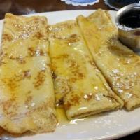 German Pancakes · Thin European - style pancakes topped with lemon sauce. Served with lemon wedges and powdere...