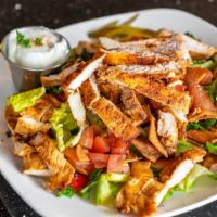 Fattoush Salad · Signature lebanese salad with pita chips and an oil vinegar dressing.