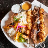 Mixed Grill Dinner · Chicken kabob, steak kabob and a choice of shrimp or kafta (please note). Served with rice a...