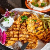 Deboned Chicken Dinner · Boneless chicken breast grilled to perfection. Served with pickles and garlic. Served with r...