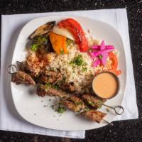 Shish Kabob Dinner · 2 juicy steak skewers grilled with onions, lettuce and tomatoes. Served with tahini sauce. S...