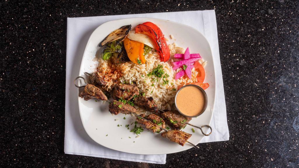 Shish Kabob Dinner · 2 juicy steak skewers grilled with onions, lettuce and tomatoes. Served with tahini sauce. Served with rice and choice of hummus or salad.