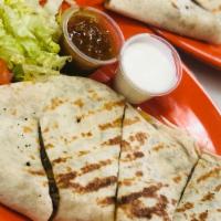 Chicken Quesadilla · Our famous shawarma and a delicious blend of mixed cheese topped with lettuce, tomato, onion...