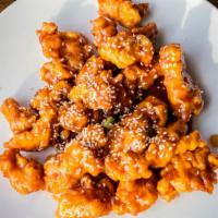 Lunch Sesame Chicken · Battered crispy chicken pieces stir-fried in a sweet and savory sauce with sesame seed on th...