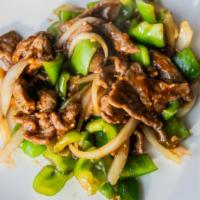 Lunch Pepper Steak · Top Sirloin steak slices stir-fried with green pepper, white onion in a Chinese brown rice w...