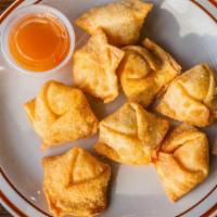 Crab Rangoon (8) · Fried puffs filled with cream cheese, crabmeat and onion