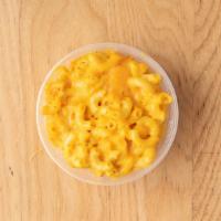 Magnificent Macaroni And Cheese · Elbow macaroni covered in a creamy three cheese sauce and baked to a golden brown