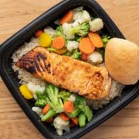 Salmon Dinner · Savory Salmon filet served along side white rice, fresh steamed vegetable's of the day and a...