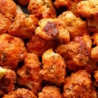 Cauliflower Wings · 1/2 pound Cauliflower florets fried and served plain or tossed in your favorite sauce