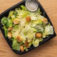 Caesar Salad - Full Size · Leafy Romaine lettuce accompanied with Caesar dressing garnished with parmesan cheese and se...