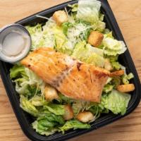 Caesar Salmon Salad · Leafy Romaine lettuce accompanied with Caesar dressing garnished with parmesan cheese and se...