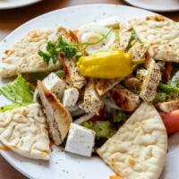 Mediterranean Salad · Crisp romaine lettuce, onions, tomato wedges, pepperoncinis, crumbled feta cheese, Greek oli...