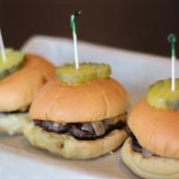 Sliders · Three Hereford beef sliders served on a
martin’s potato roll with
American cheese, sauteed o...