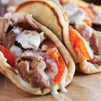 #1 Gyro · Served with gyro sauce, onions and tomatoes. Choose a Drink: Brisk raspberry ice tea, Diet P...
