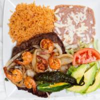 Mar Y Tierra · Authentic carne asada and shrimp. Served with rice, refried beans, a salad with fresh avocad...
