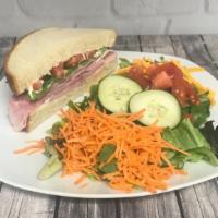 Half Sandwich & Salad Combo · Half sandwich and a small green salad.