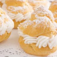 Cream Puff · Cream puffs filled with vanilla, chocolate, or strawberry Bavarian Cream Cheesecake filling.
