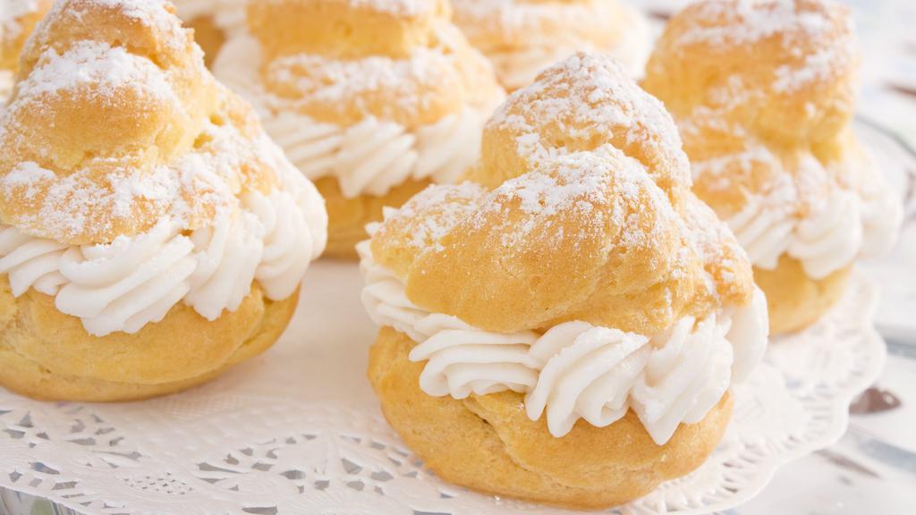 Cream Puff · Cream puffs filled with vanilla, chocolate, or strawberry Bavarian Cream Cheesecake filling.