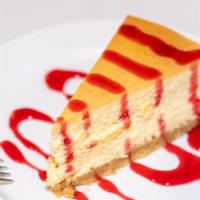 Cheesecake · Vegetarian. NY style cheesecake with an almond graham cracker crust, topped with choice of r...
